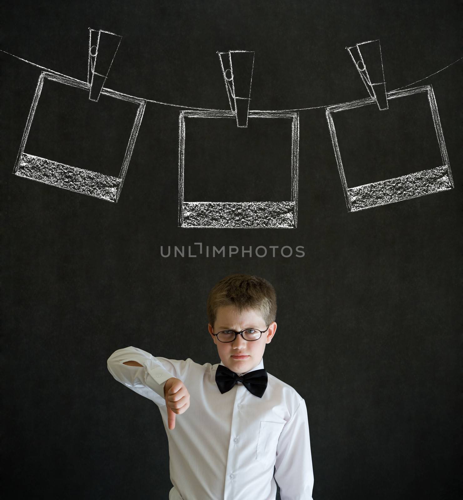 Thumbs down boy business man with hanging instant photo photograph on clothes line by alistaircotton