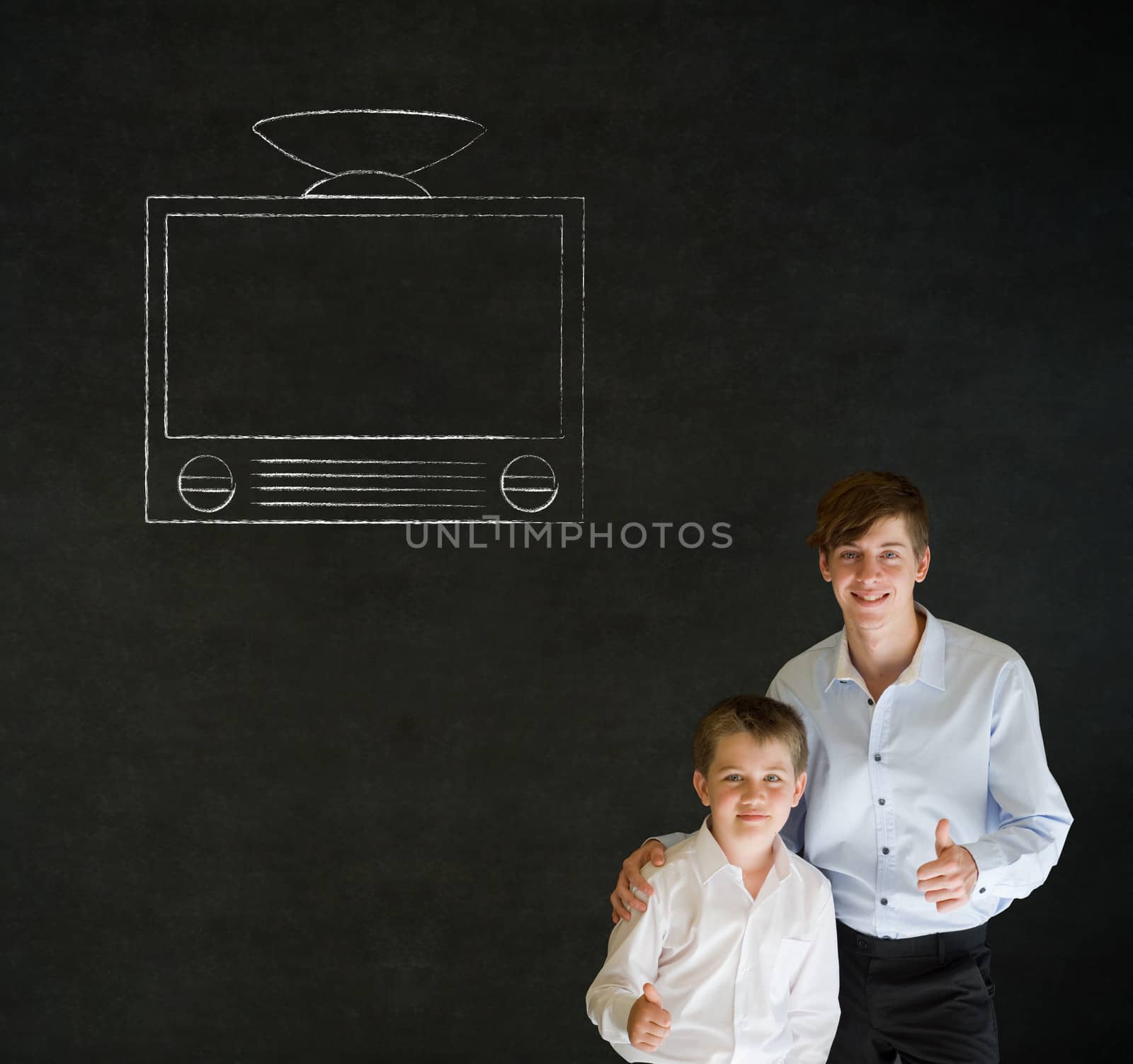 Thumbs up boy dressed up as business man with teacher man and chalk tv television on blackboard background