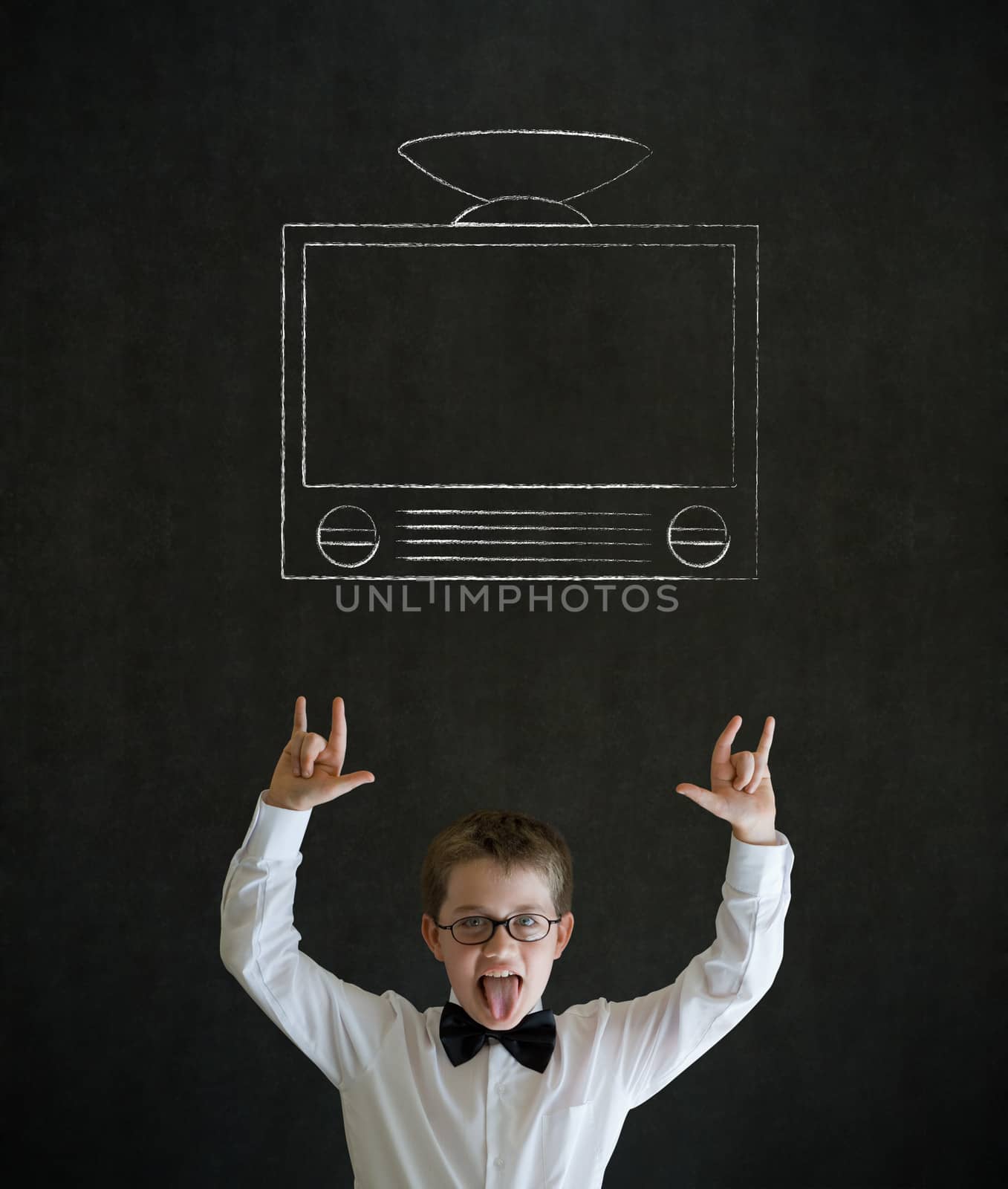 Knowledge rocks boy dressed up as business man with chalk tv television on blackboard background