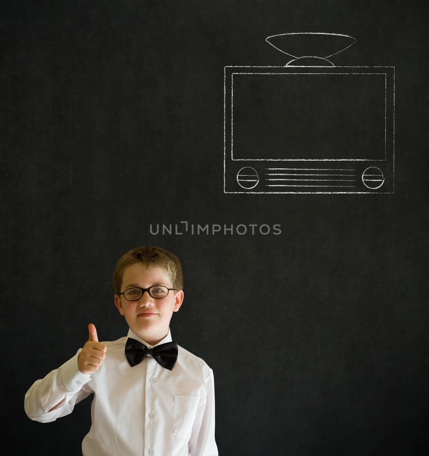 Thumbs up boy dressed up as business man with chalk tv television on blackboard background