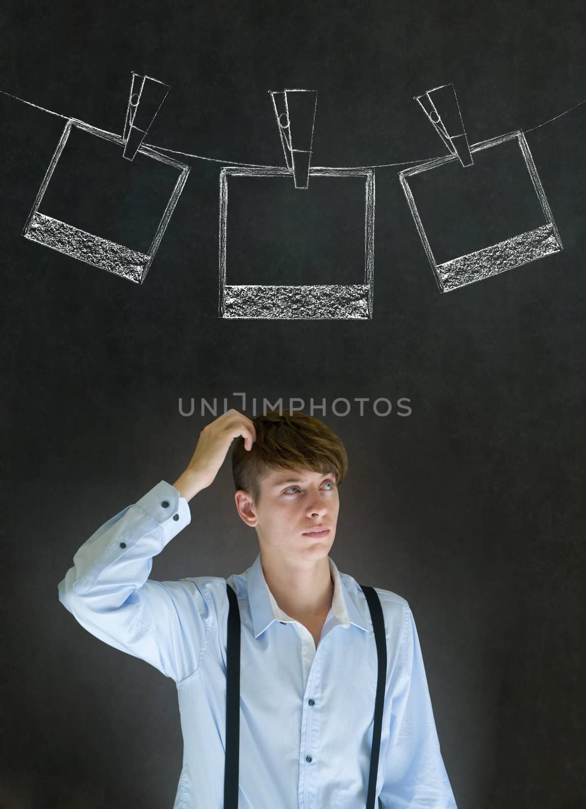 Businessman, teacher or student with chalk instant photograph style photographs on clothes line blackboard background