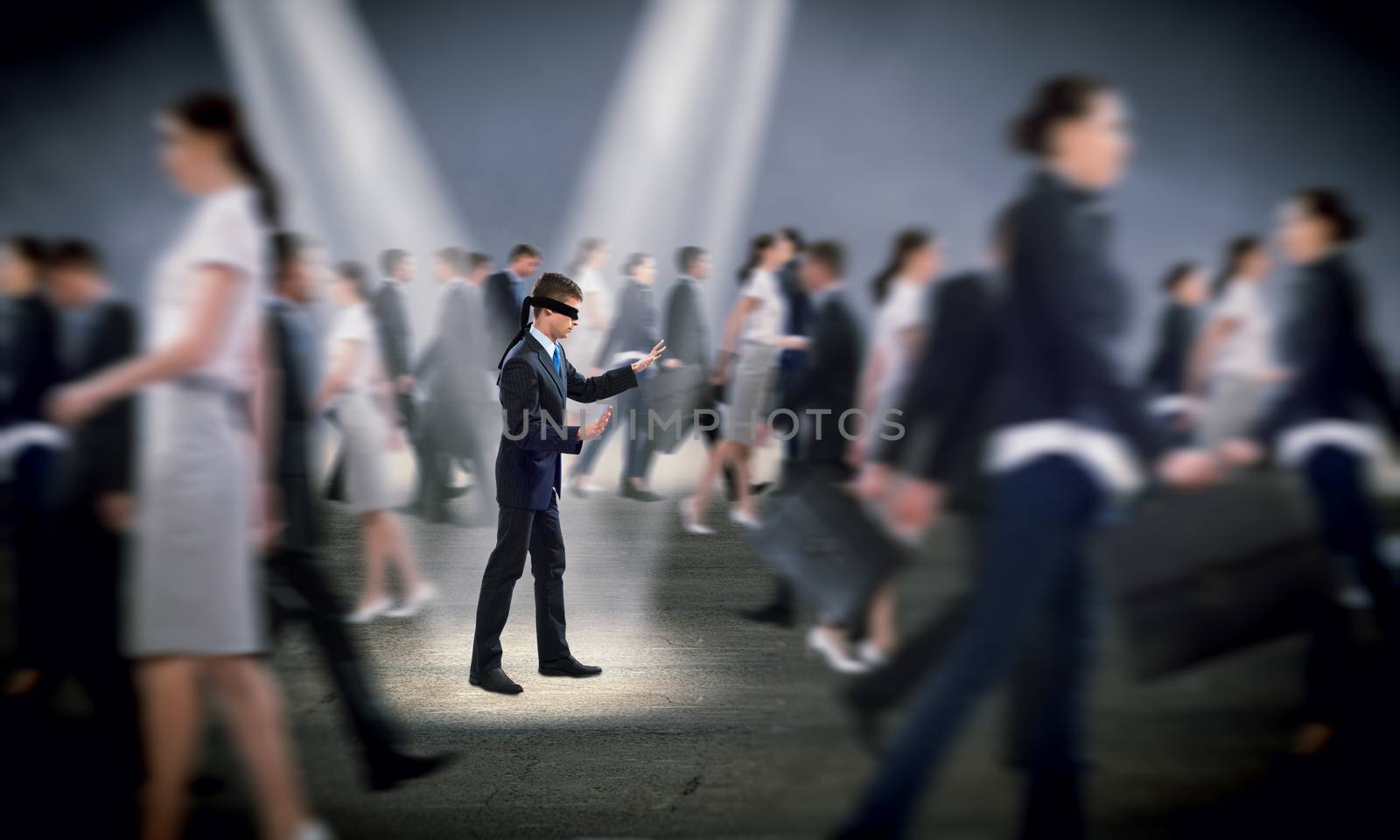 young blindfolded man. his arms and looking for a way out