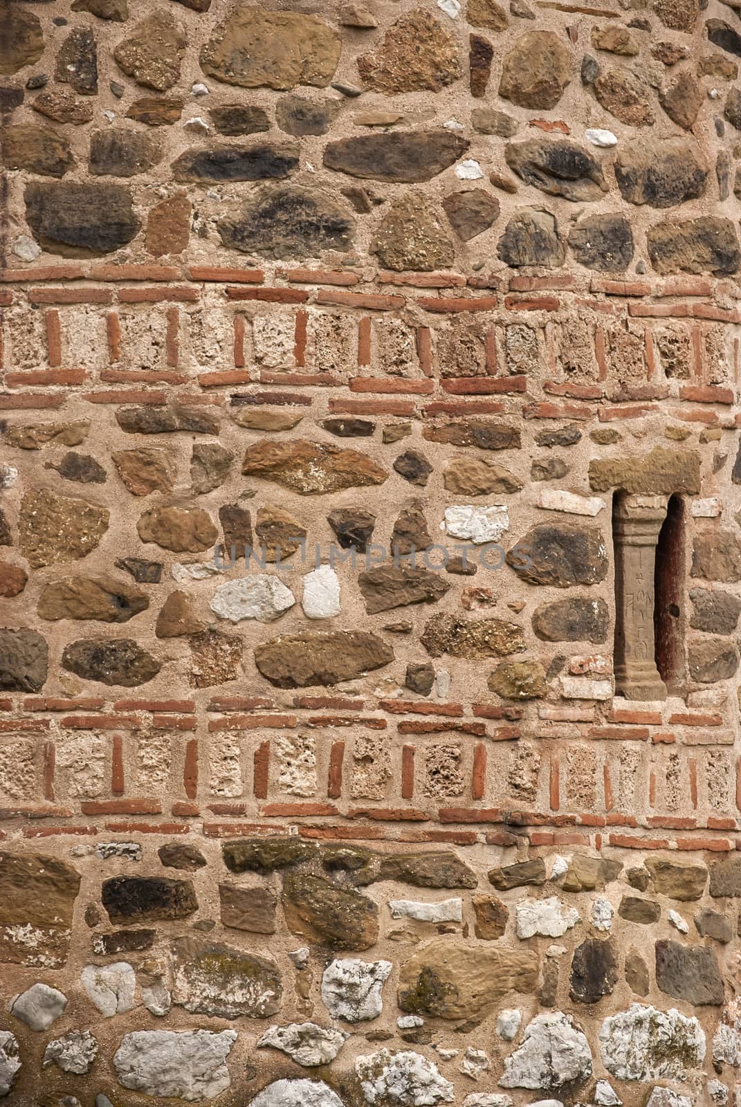 Stone and ceramic ancient church wall as background