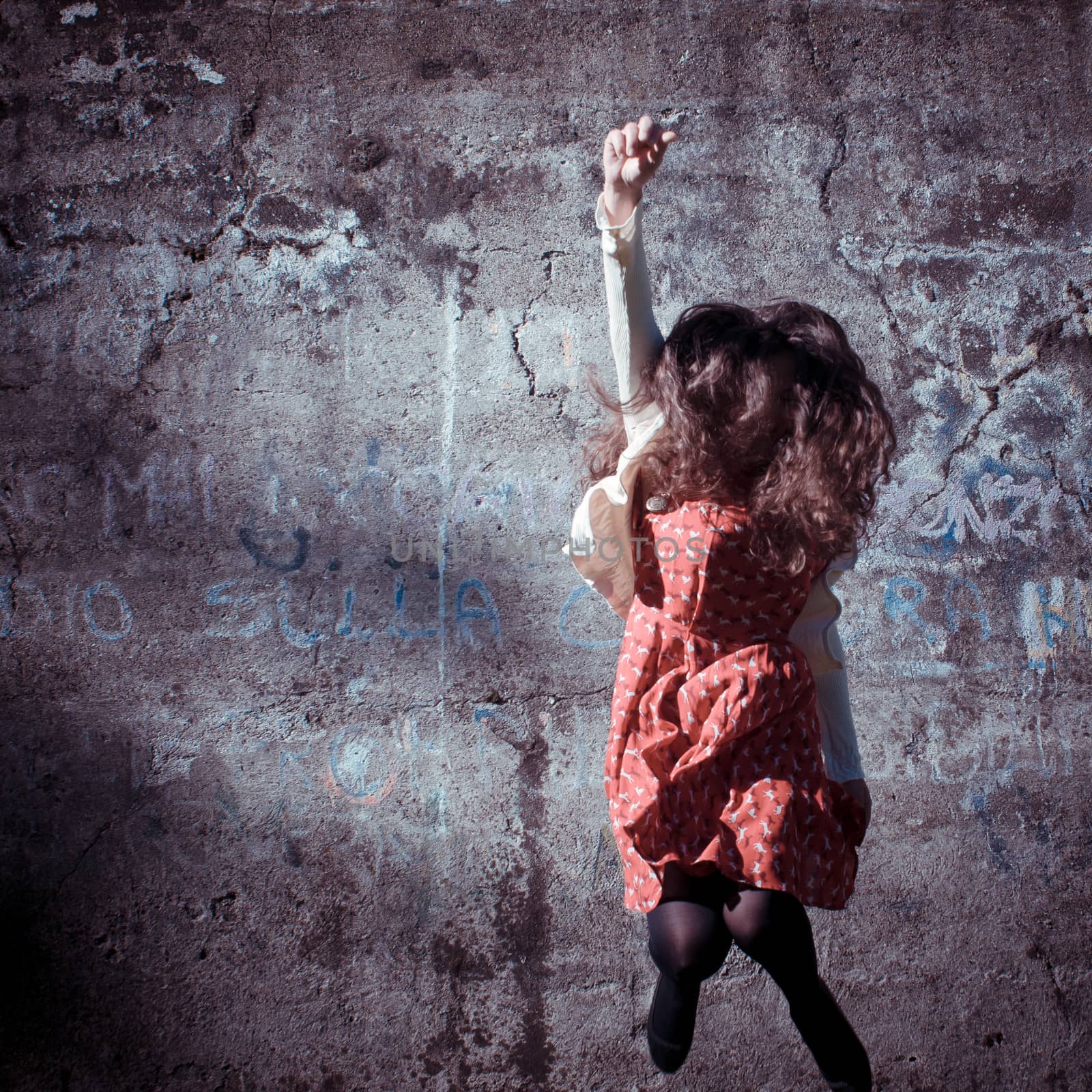 happy eastern vintage hipster woman jumping in the park