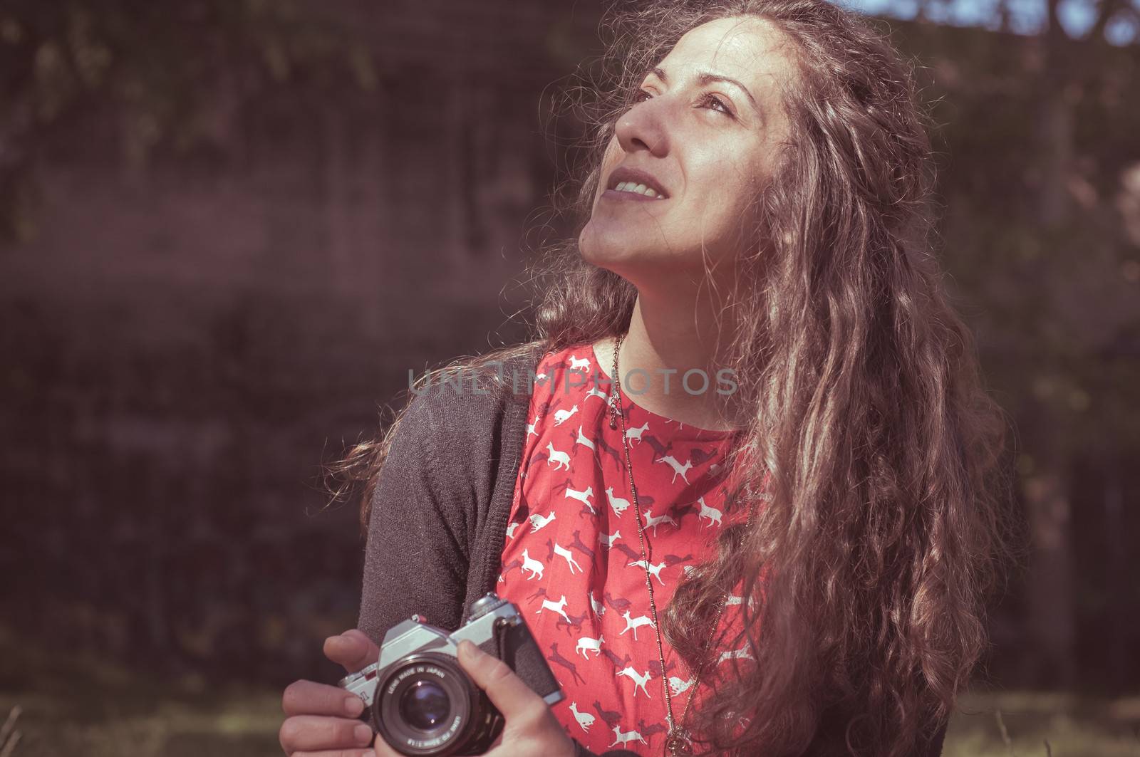 hipster vintage woman with old camera in the park