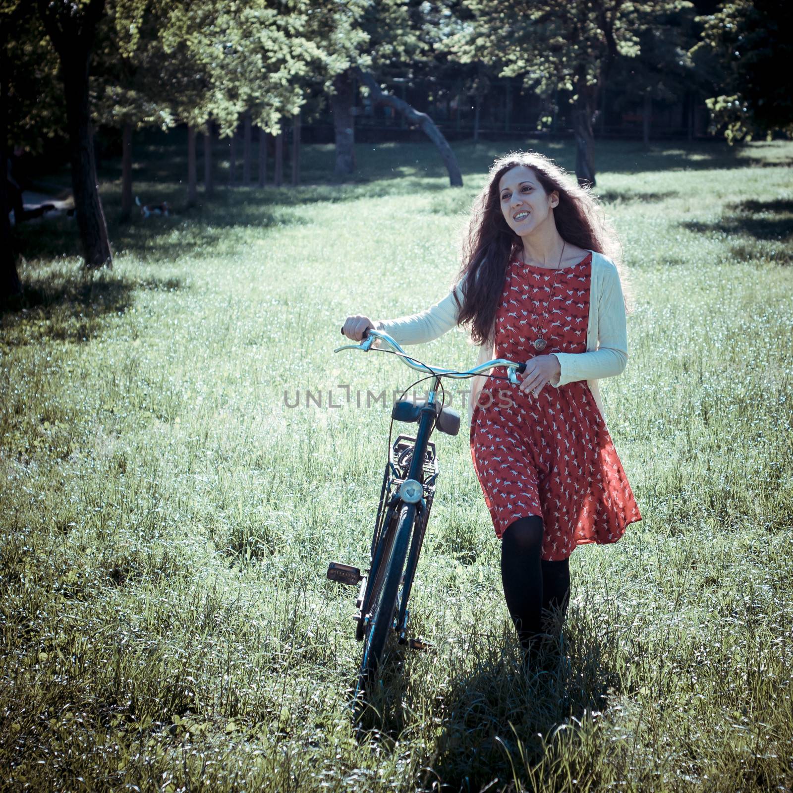 vintage eastern hipster woman with bike by peus