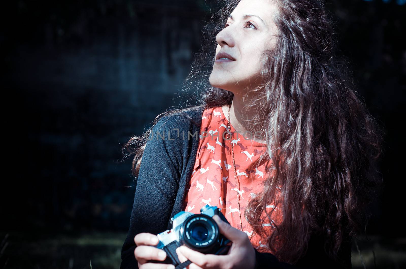 hipster vintage woman with old camera in the park