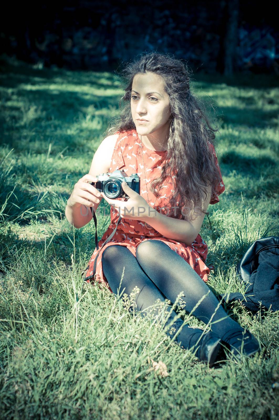 hipster vintage woman with old camera in the park
