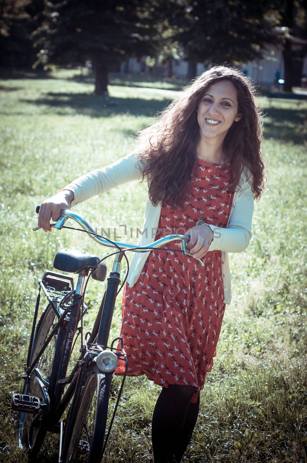 vintage eastern hipster woman with bike by peus