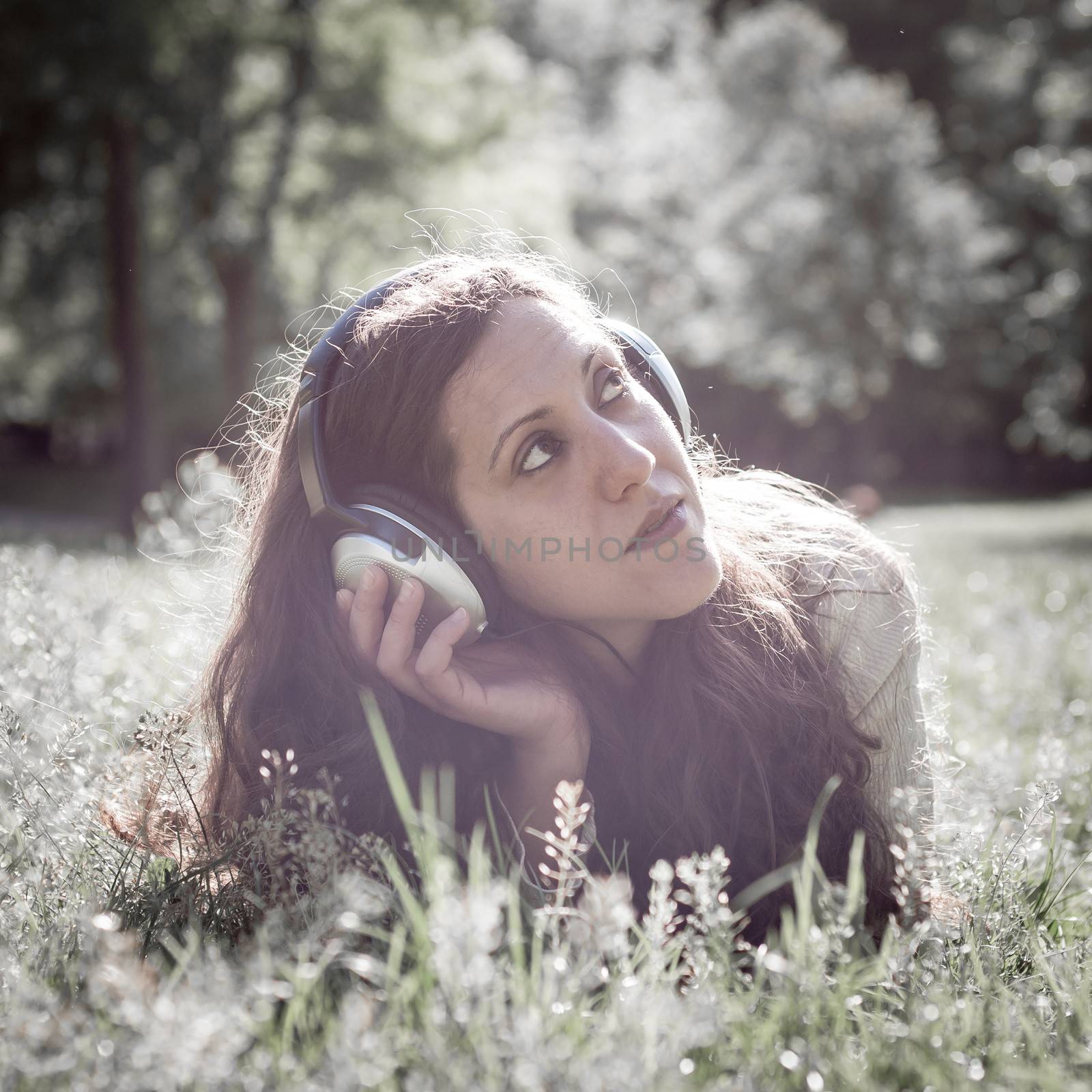 vintage hipster eastern woman with headphones by peus