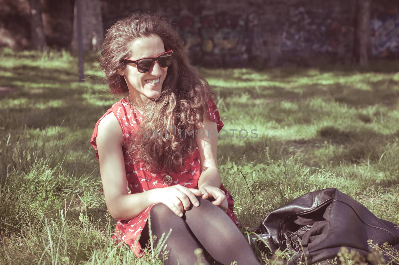 eastern hipster vintage woman with shades at the park
