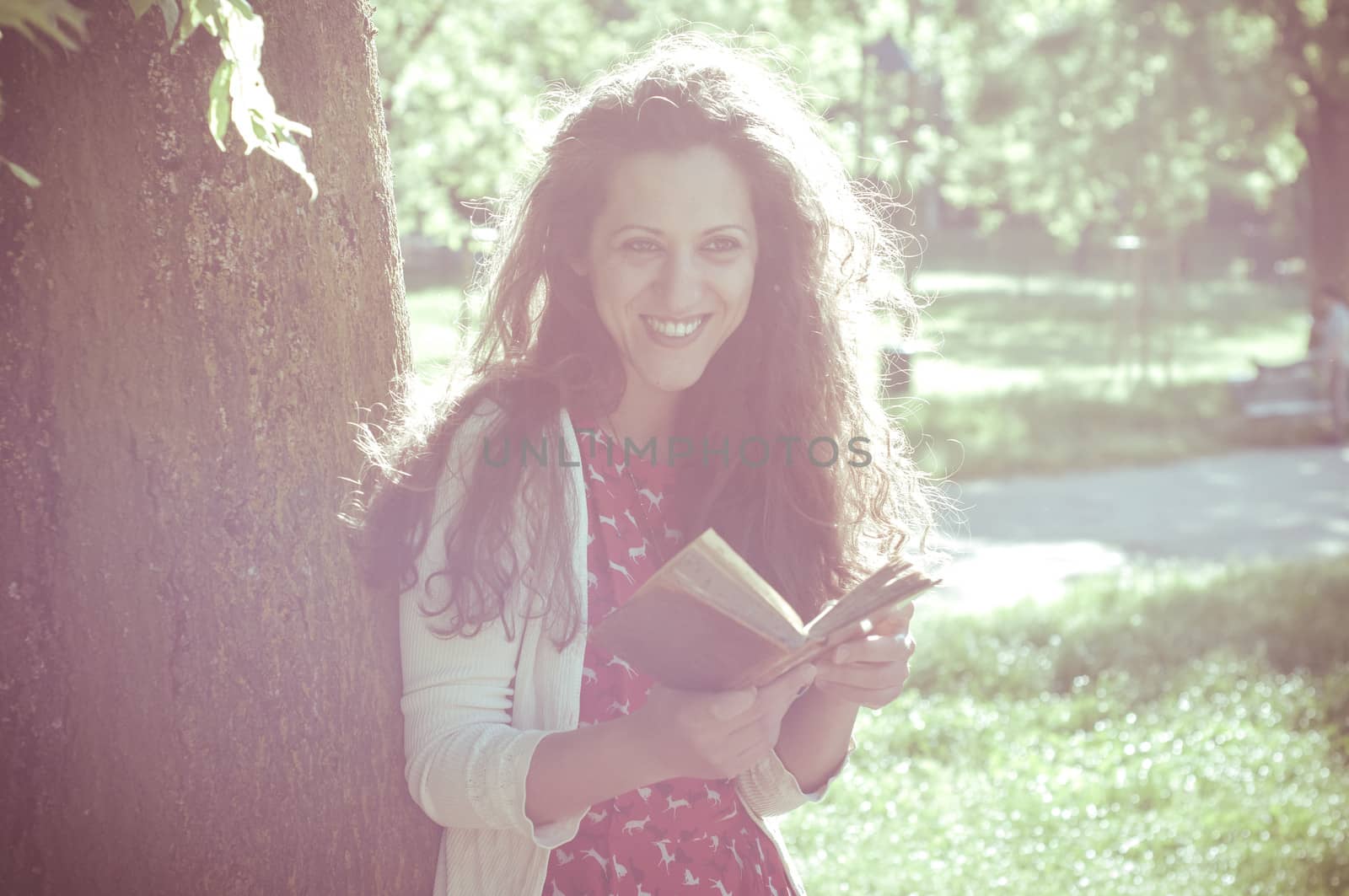 eastern hipster vintage woman reading book in the park
