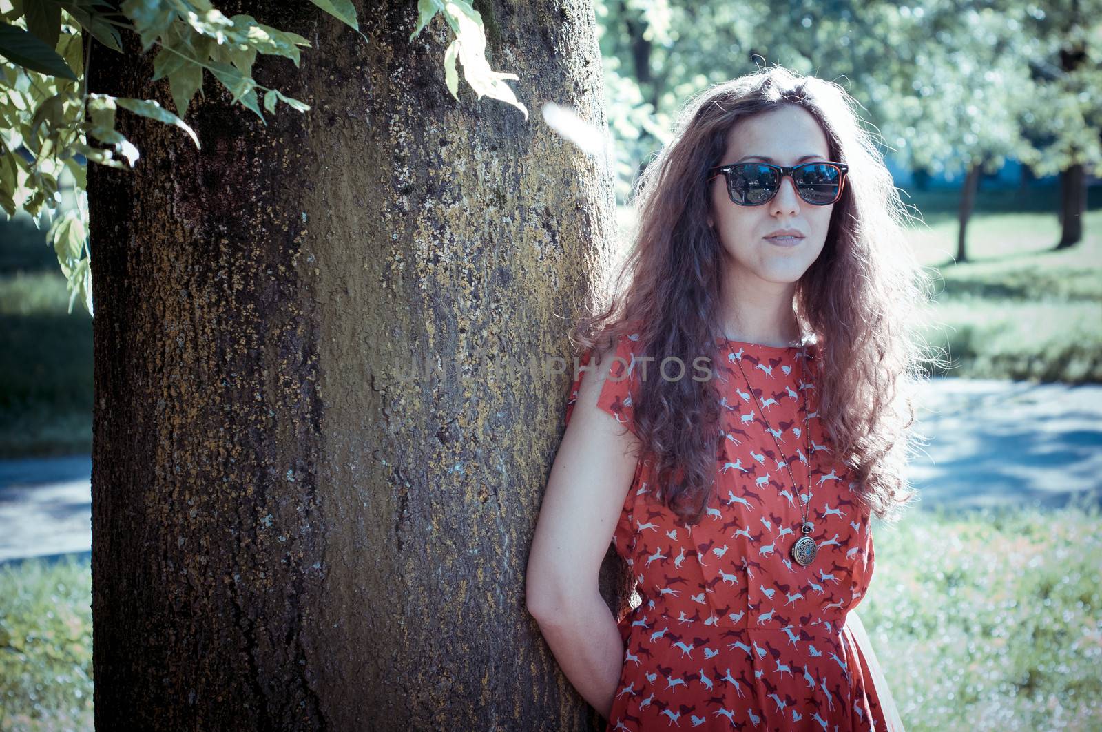 eastern hipster vintage woman with shades at the park