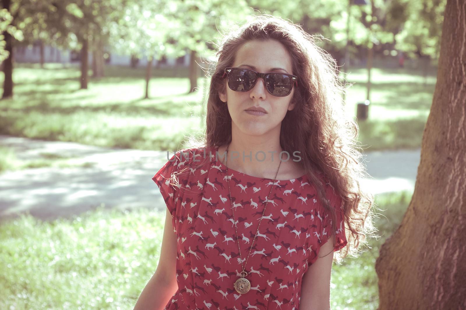 eastern hipster vintage woman with shades at the park
