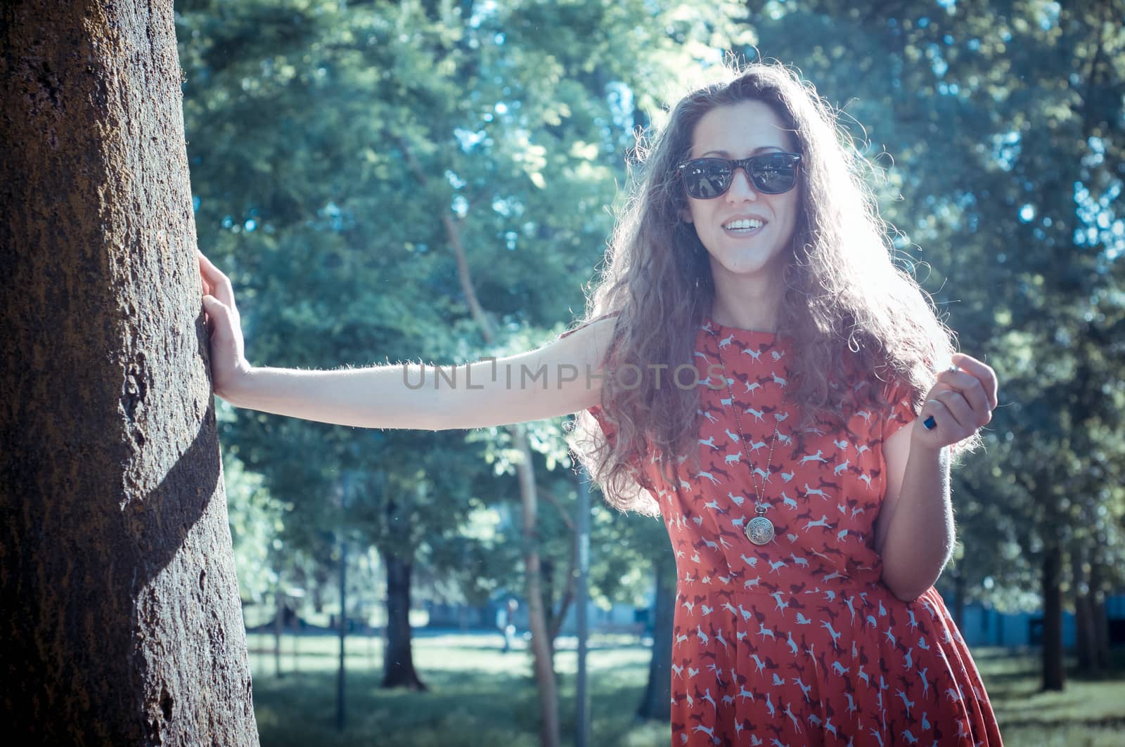 eastern hipster vintage woman with shades at the park
