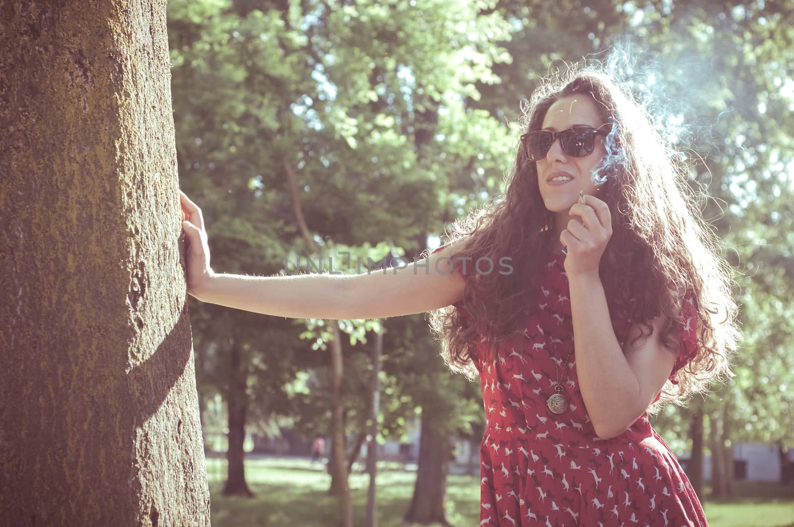 eastern hipster vintage woman with shades at the park