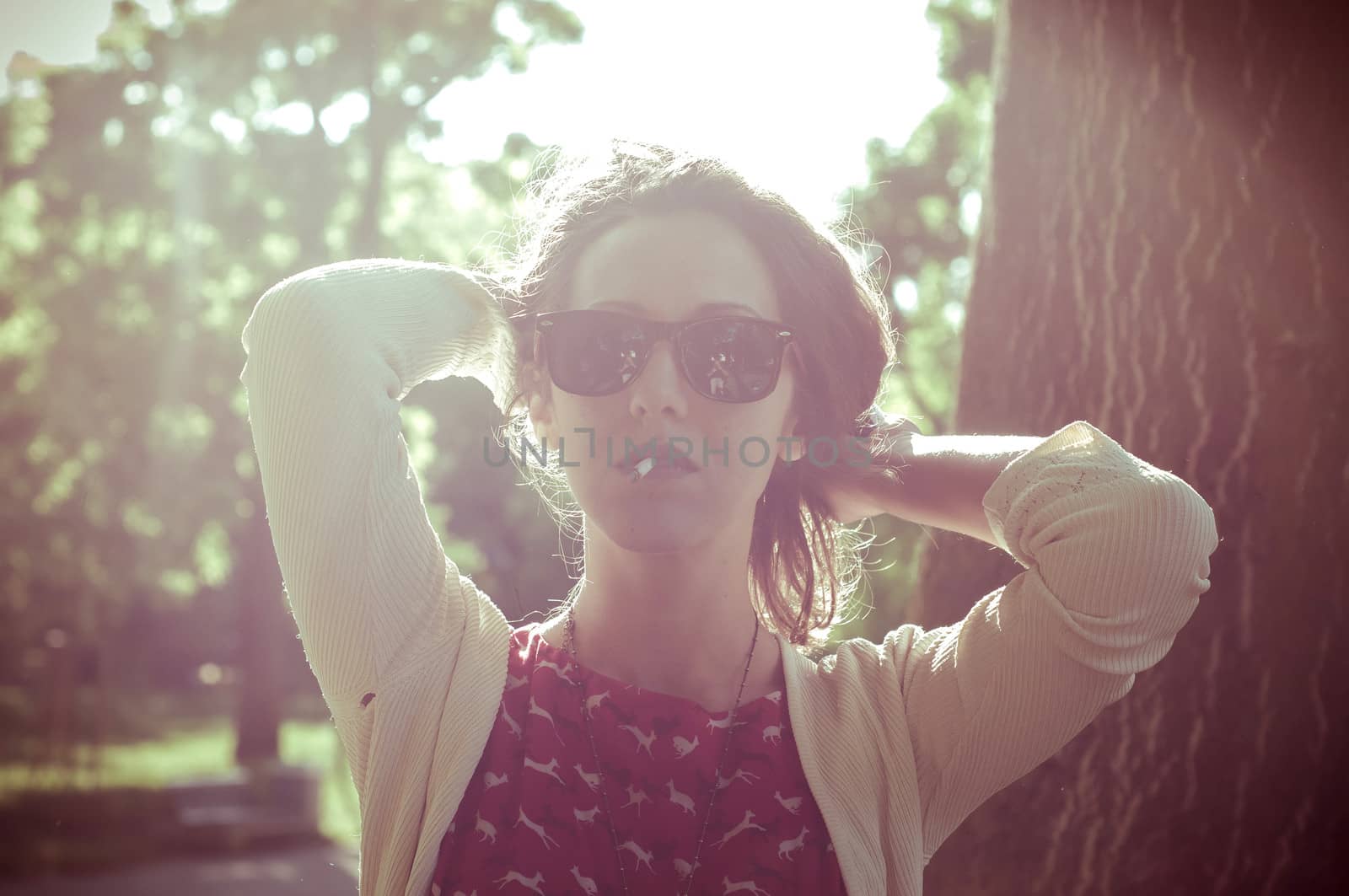 eastern hipster vintage woman with shades at the park