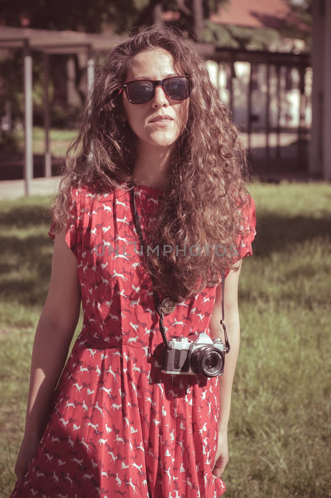 hipster vintage woman with old camera in the park
