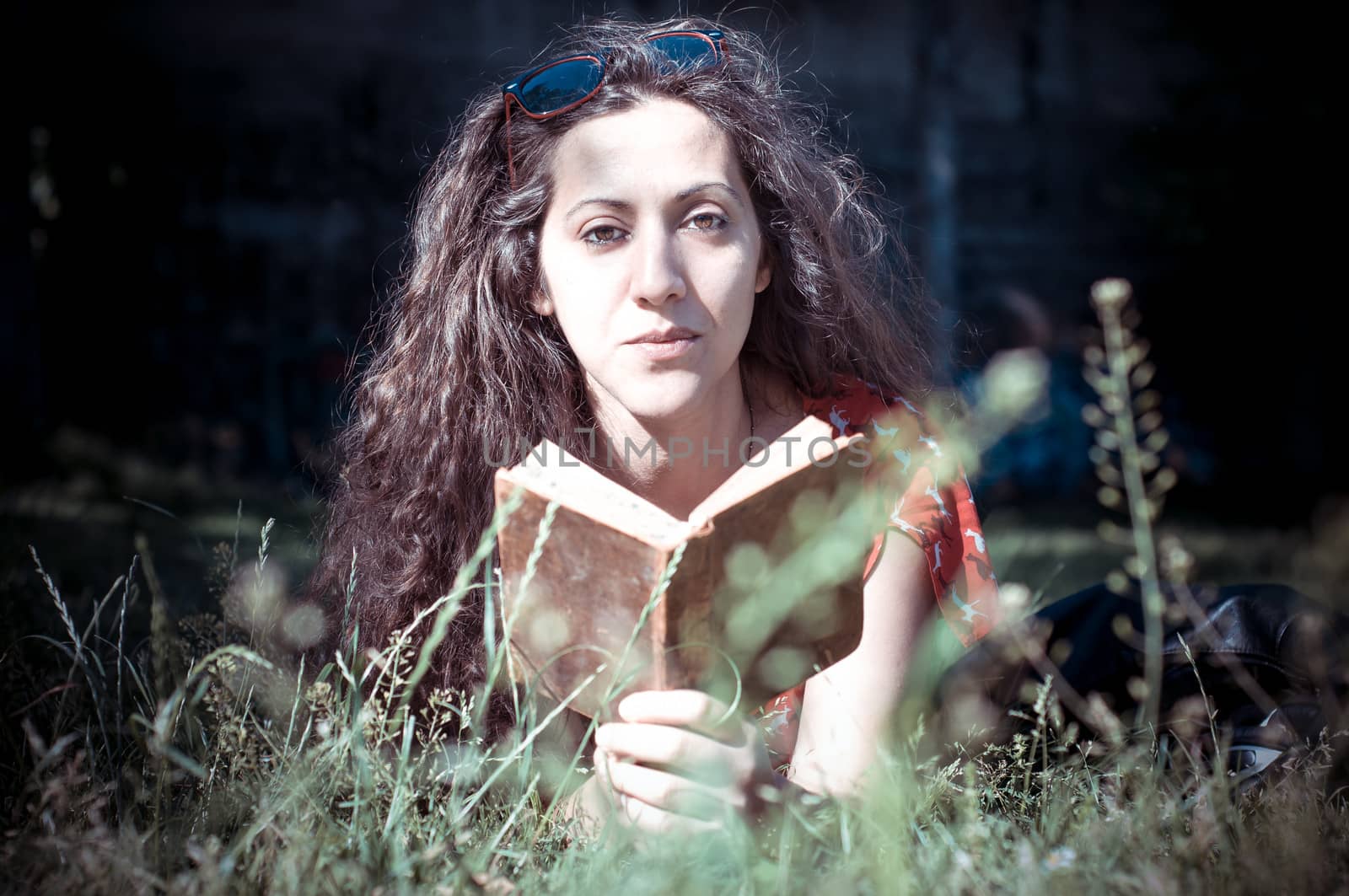 eastern hipster vintage woman reading book in the park