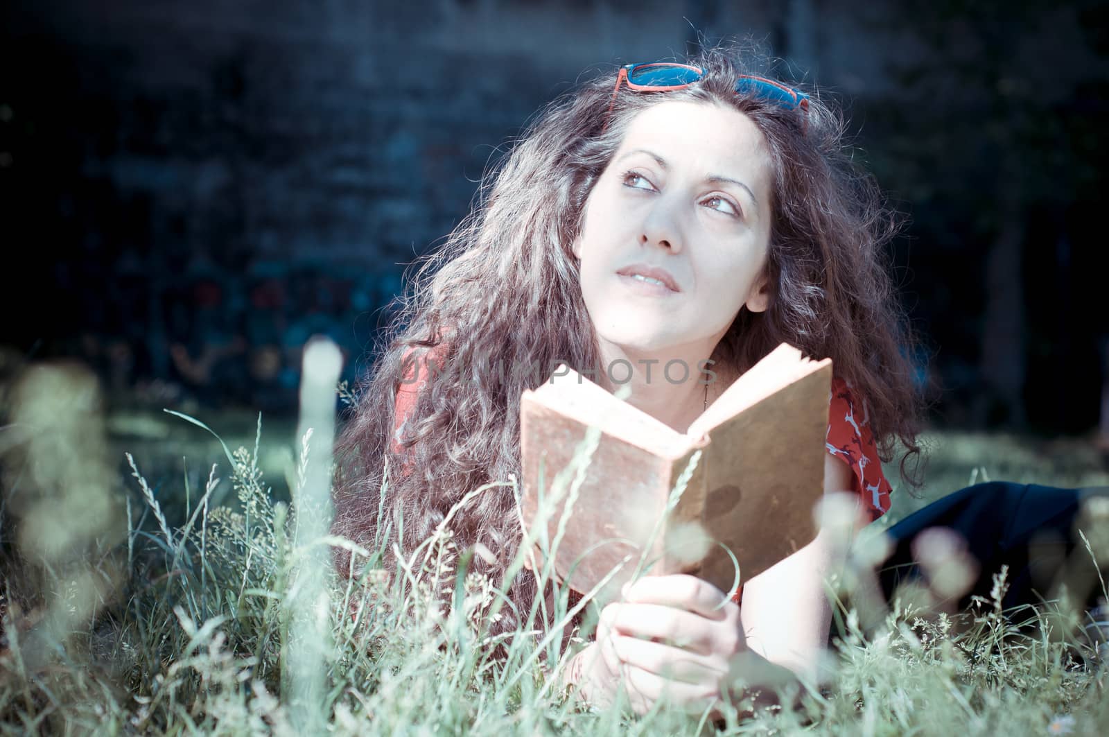 eastern hipster vintage woman reading book in the park
