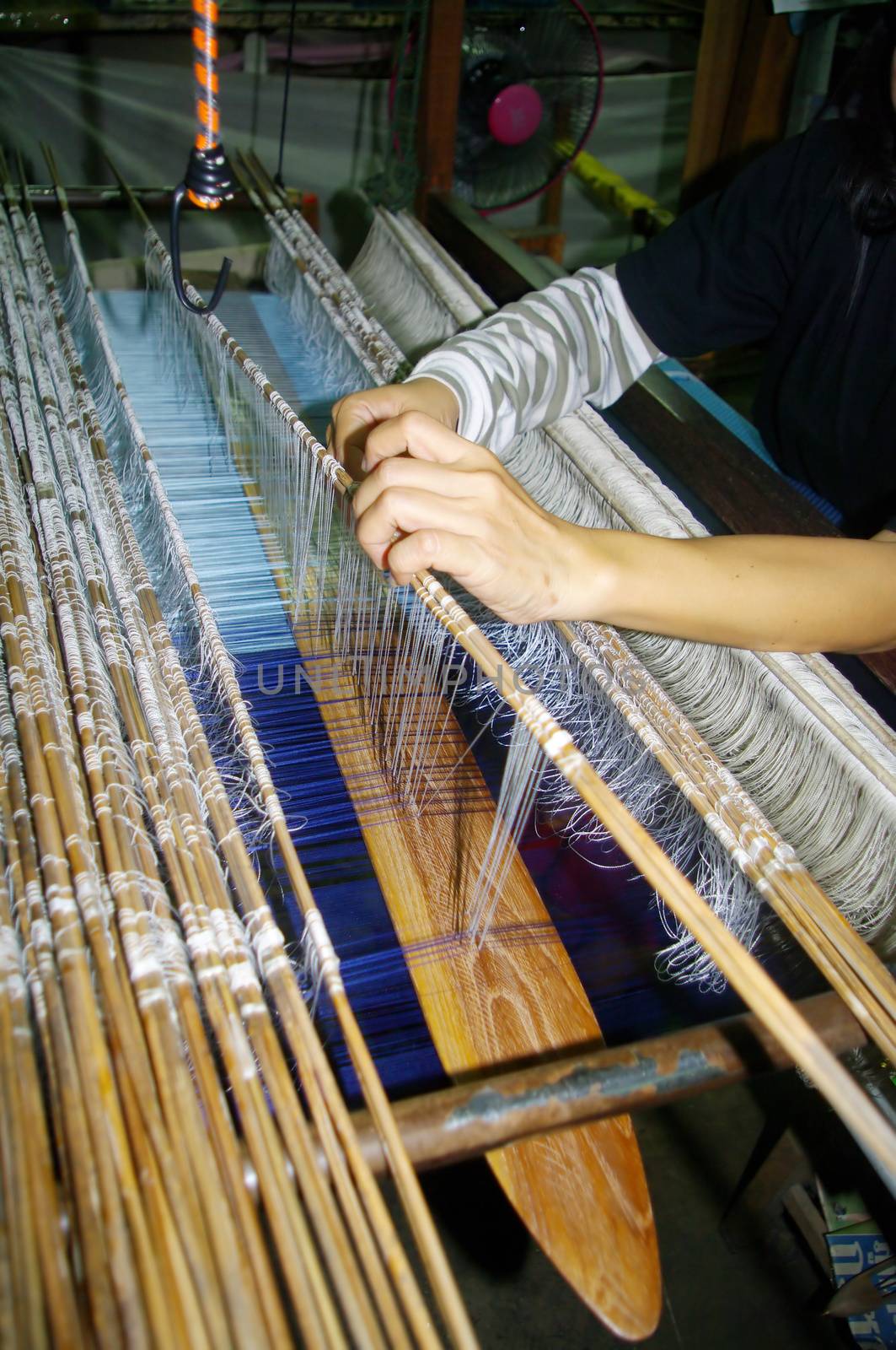 Woman on loom by Duroc