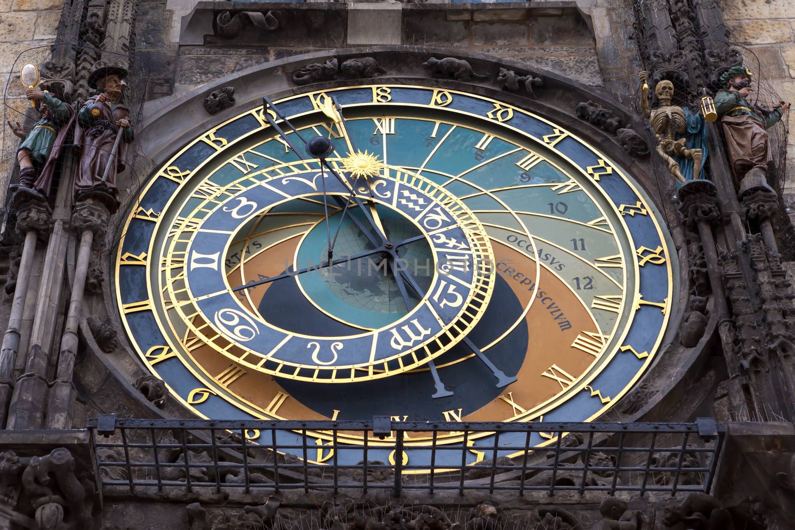 The astronomical clock situated on the wall of the old town city hall in Prague. The center section (astronomical dial) dates back to 1410, and around 1490 sculptures and the calender dial was added to it.