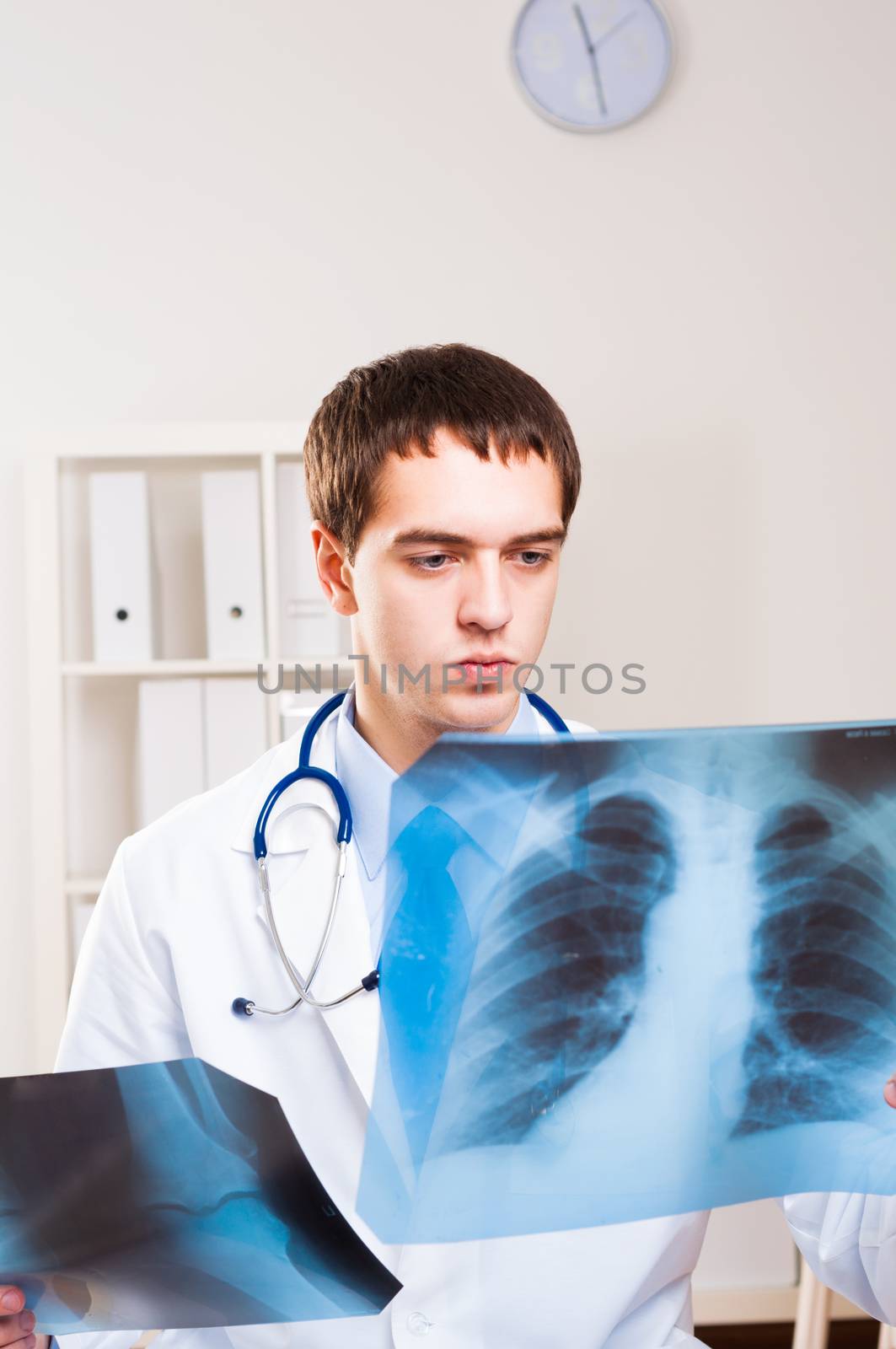 Doctor looking the x-ray picture of the chest