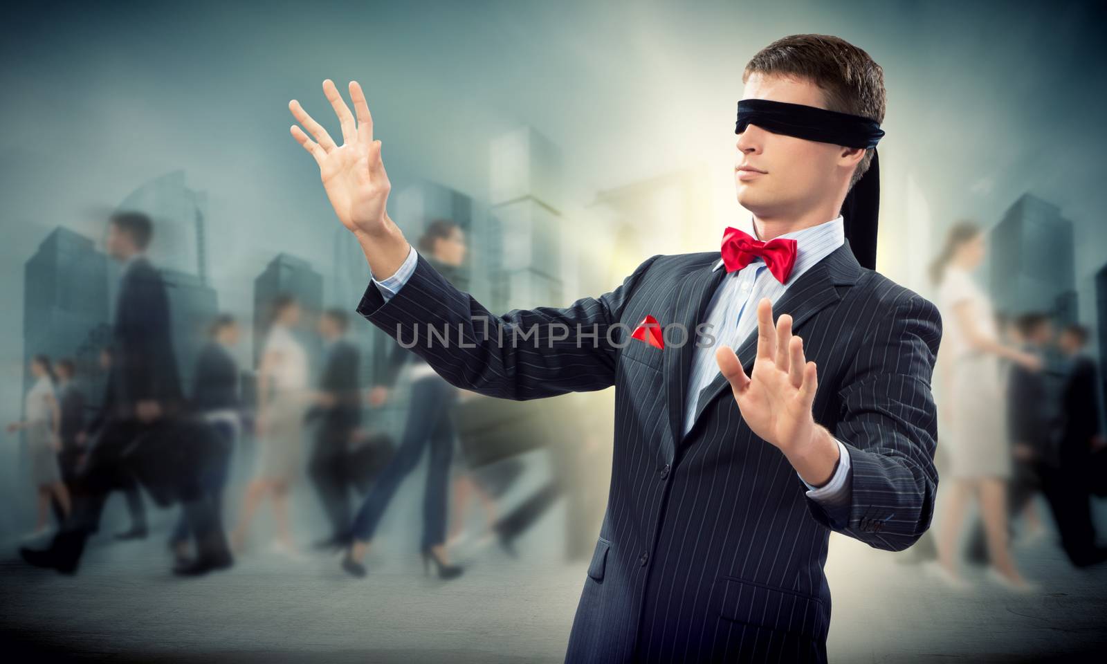 young blindfolded man. his arms and looking for a way out