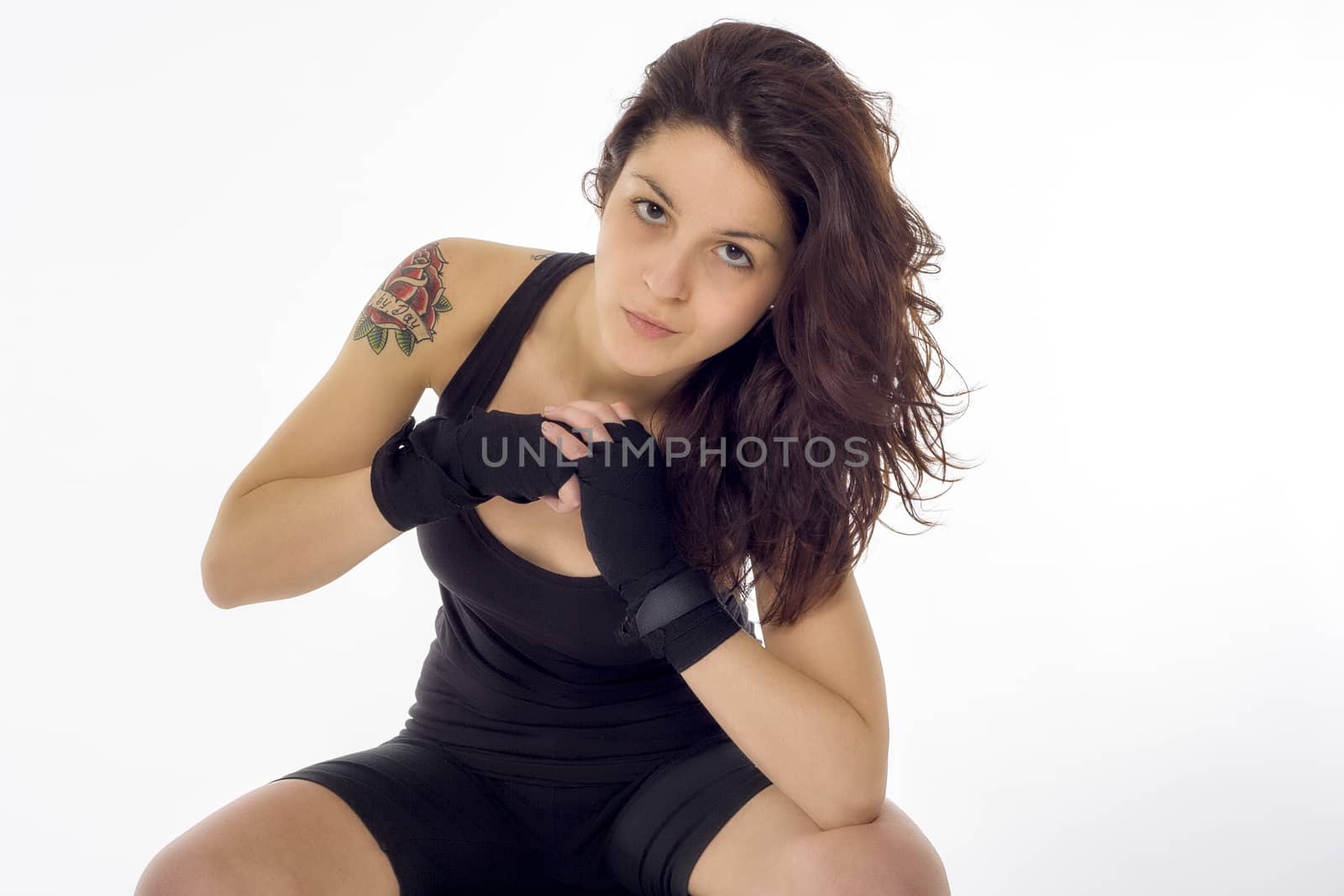 Fit female fighter posing in combat poses by icephotos