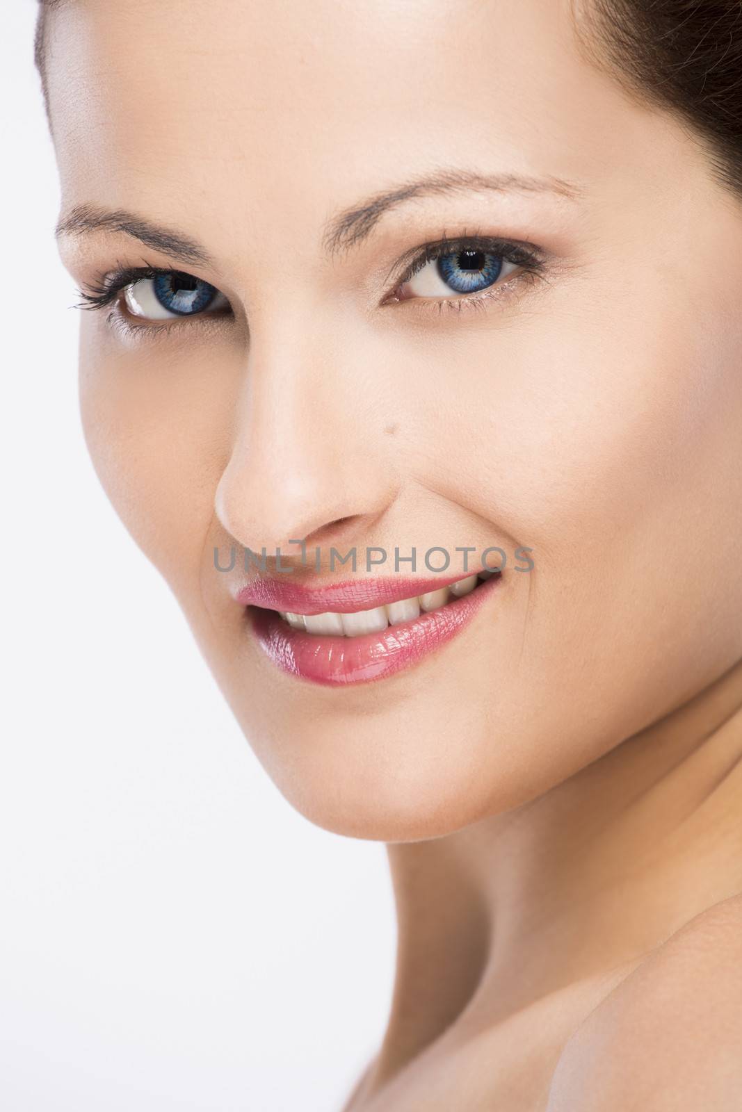 Beauty portrait of a young blonde woman, isolated on white background