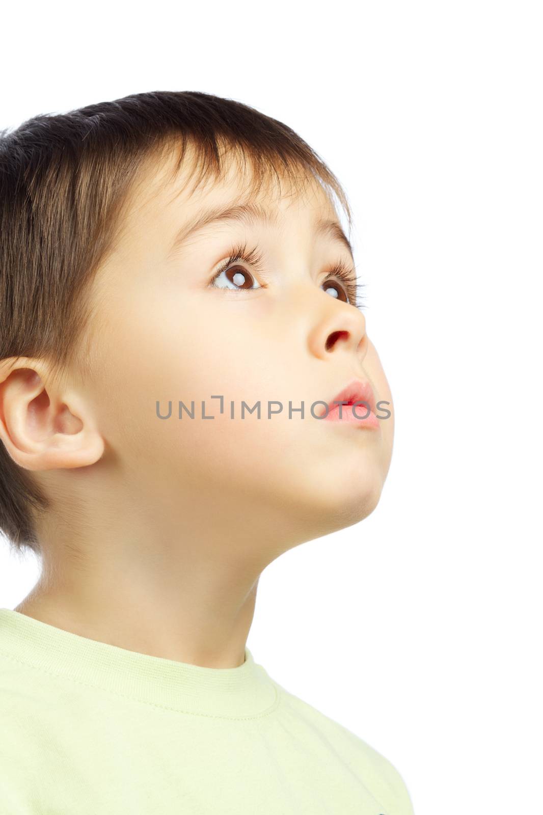 beautiful boy looking up, isolated on white