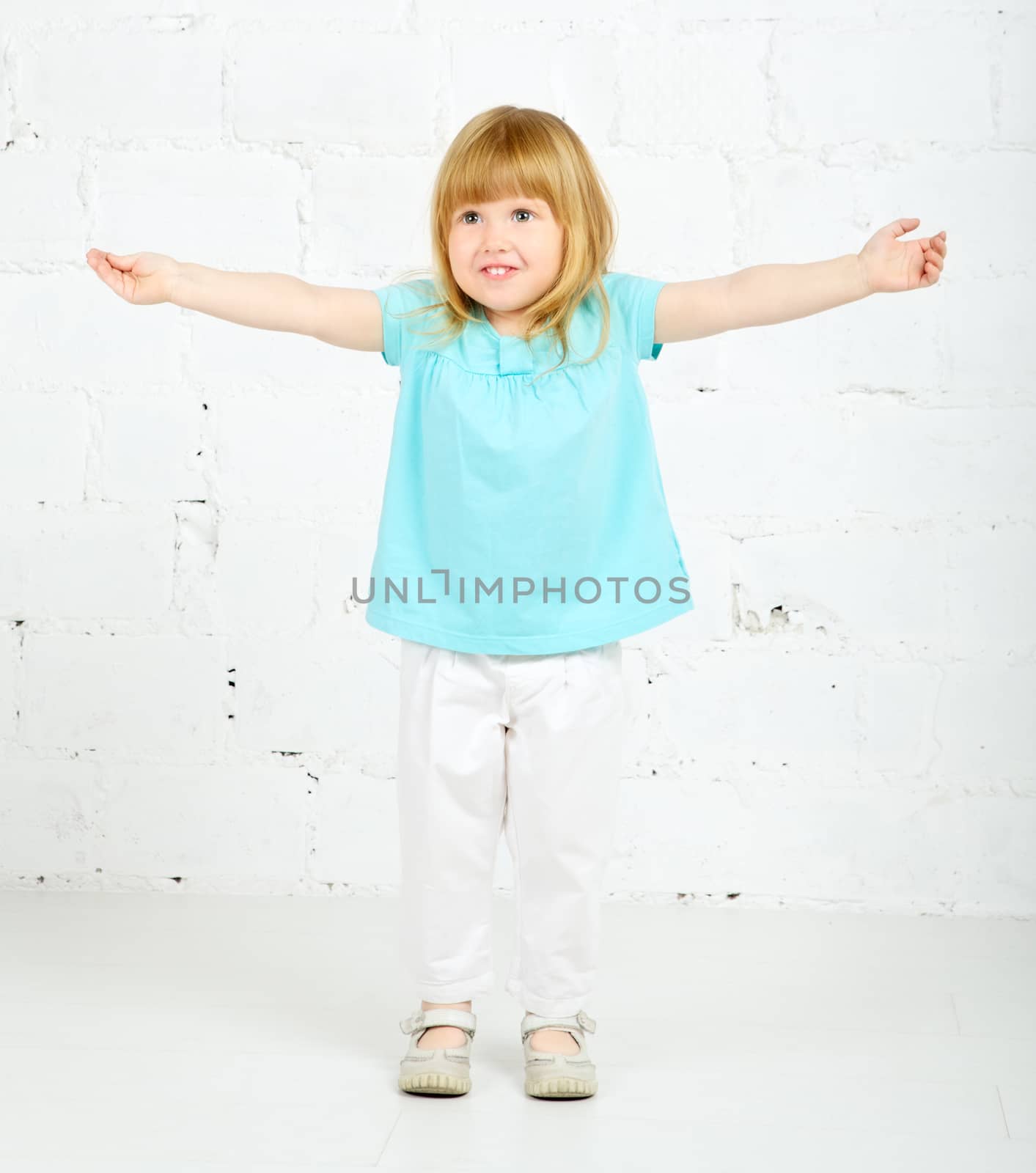 beautiful little girl playing and smilng, portrait