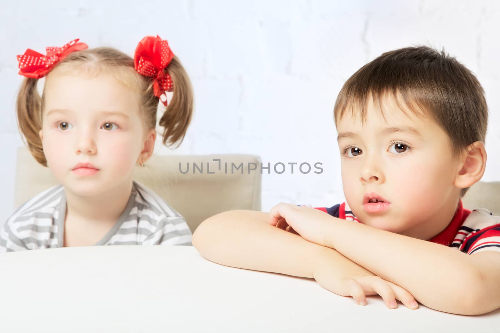 beautiful boy and girl with red bow-knot, portrait