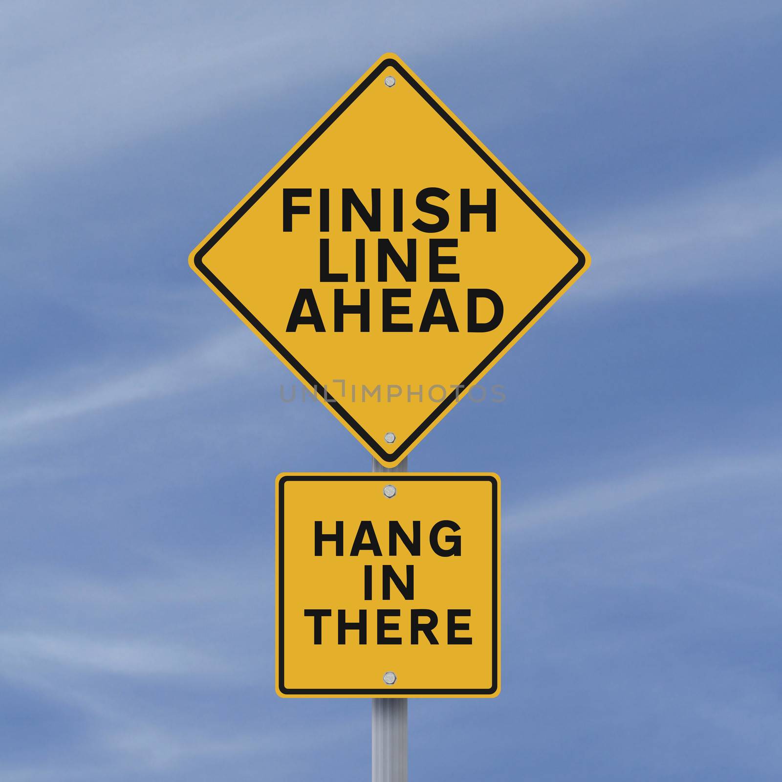 A road sign announcing the finish line coming up