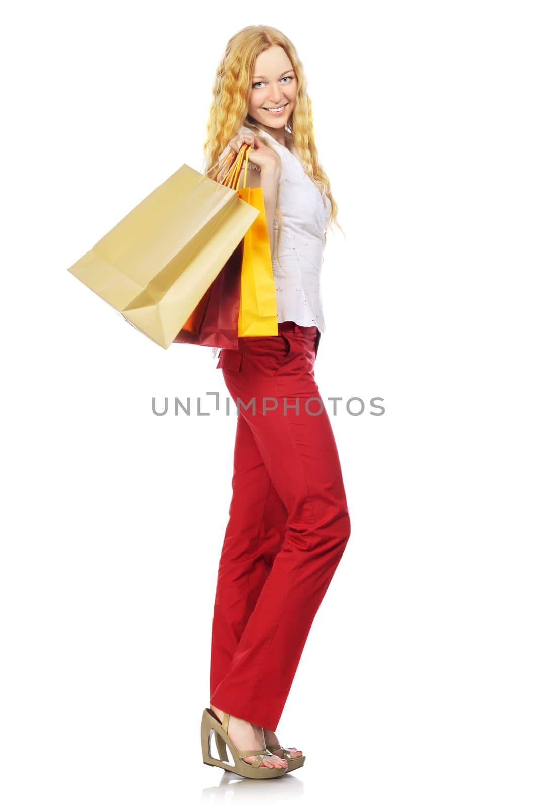 happy girl with shopping bags, isolated on white
