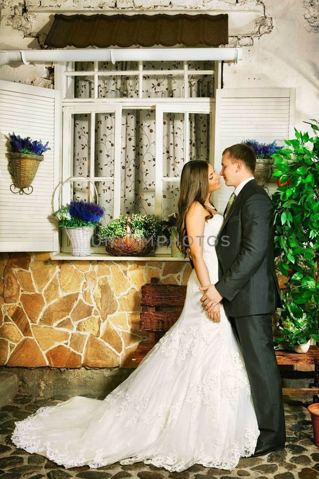 charming bride and groom next house on summer day