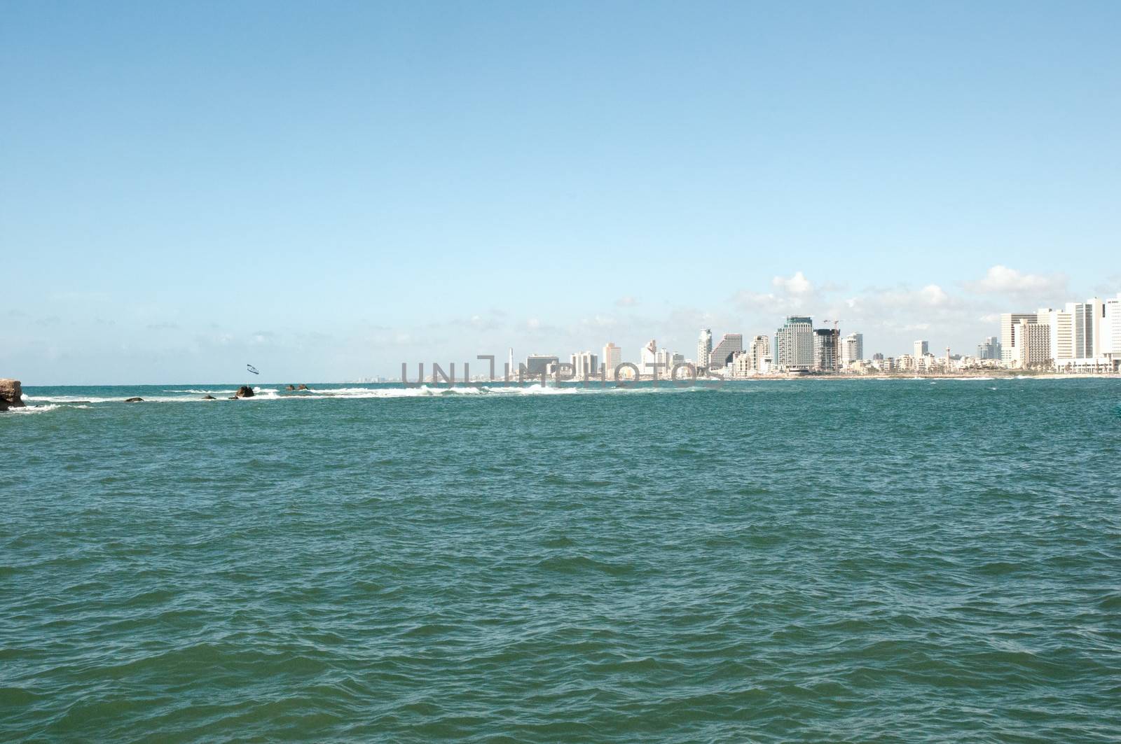 Sea coast and the view of the Tel Aviv from Old Jaffa at the evening .