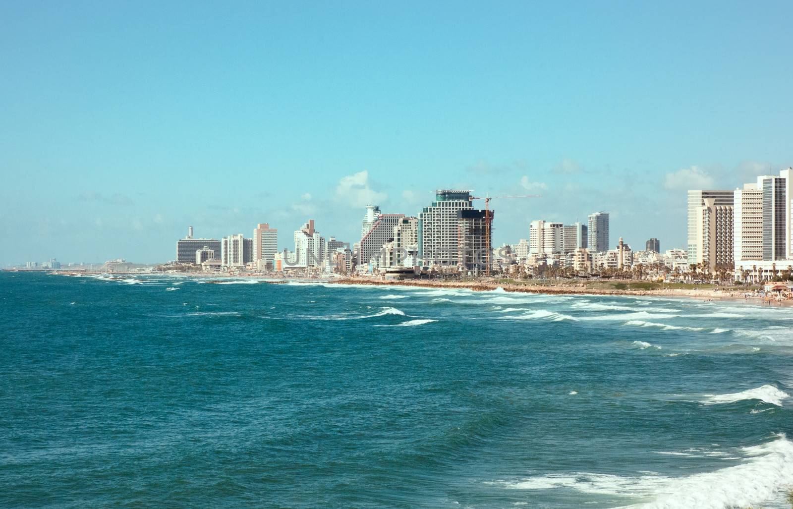 Sea coast and the view of the Tel Aviv from Old Jaffa at the evening .