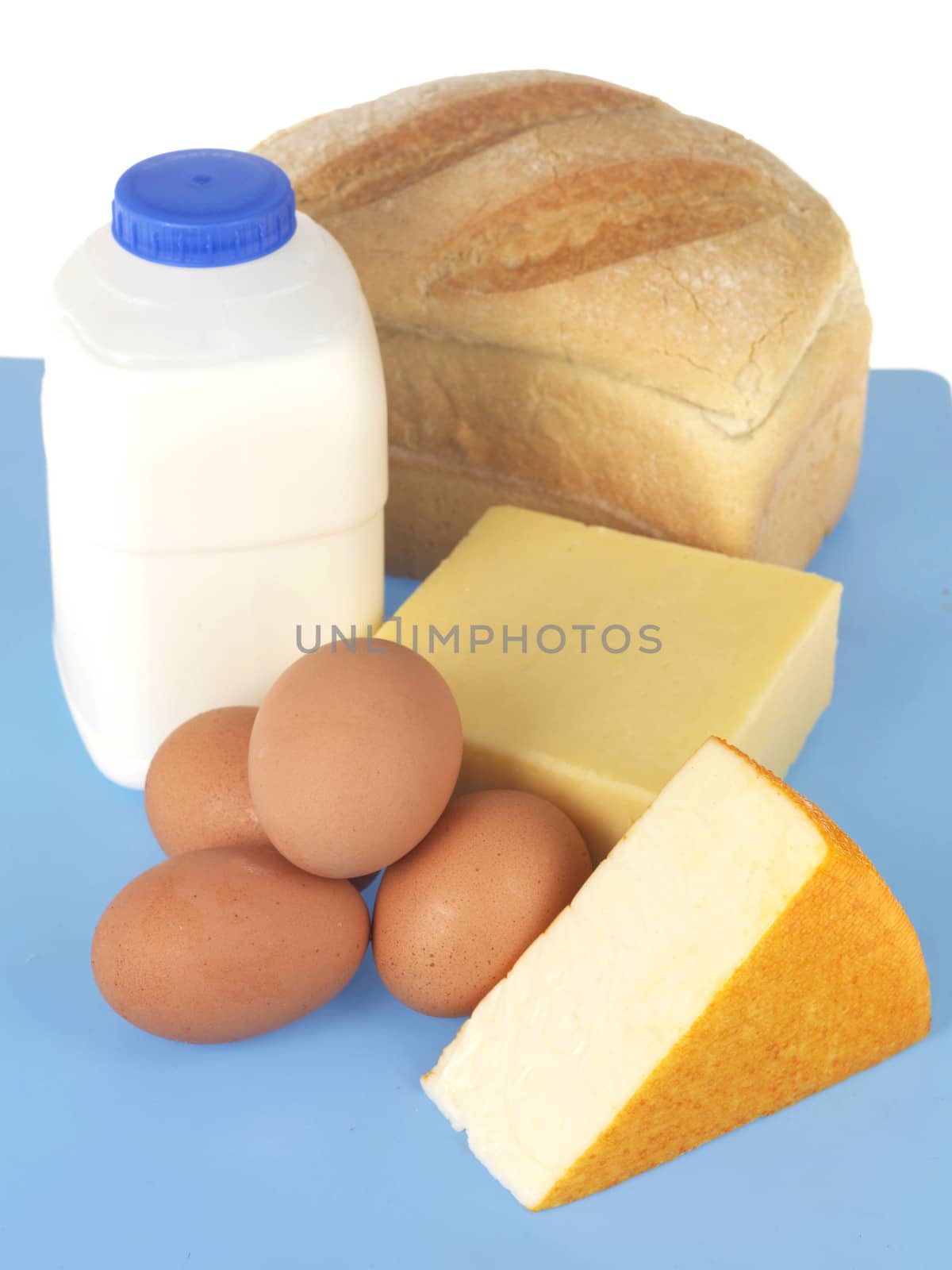 Milk Cheese Eggs and Bread Protein Foods Isolated White Background