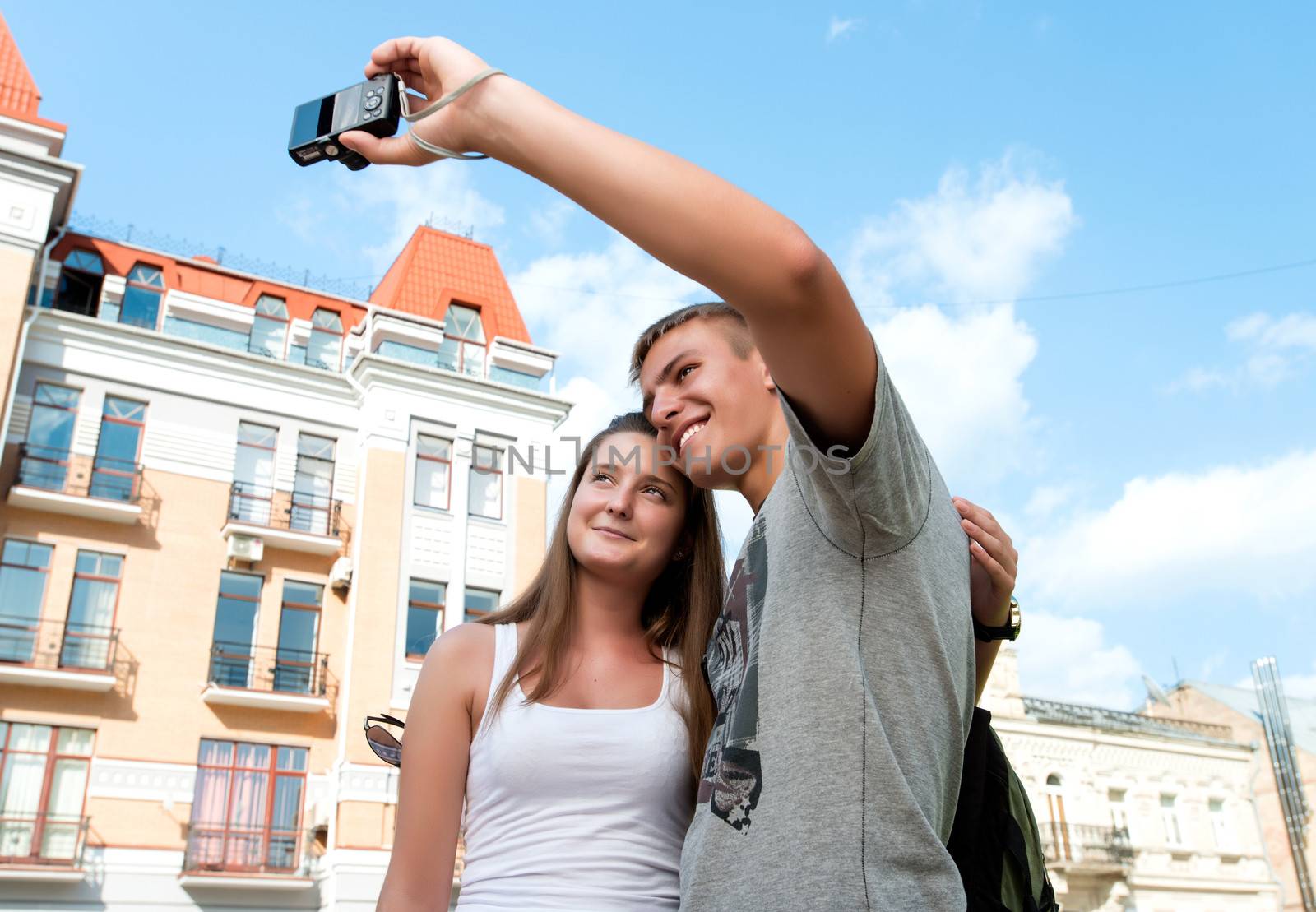 Couple take a picture together, smiling and having fun