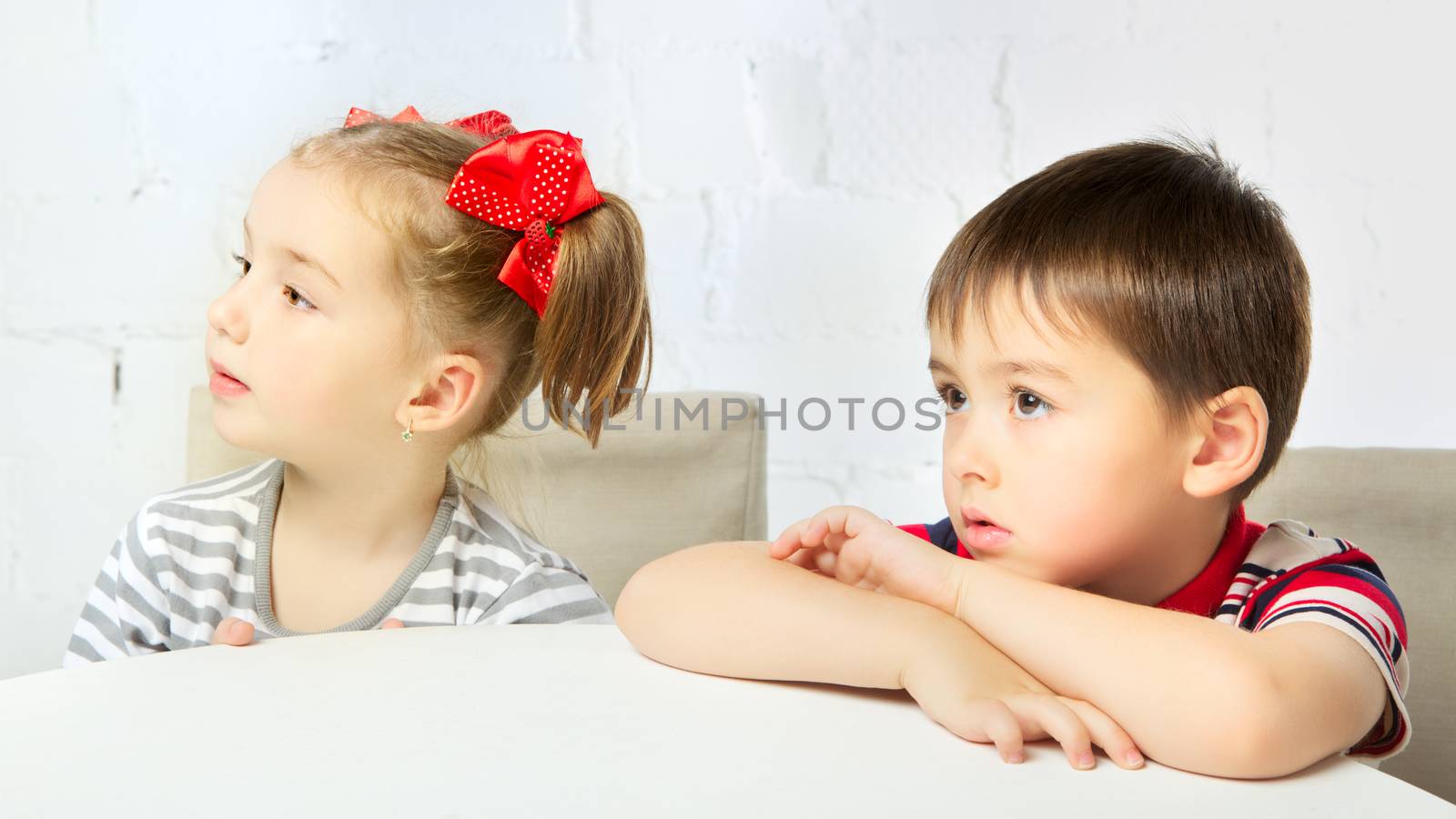 beautiful boy and girl with red bow-knot, portrait