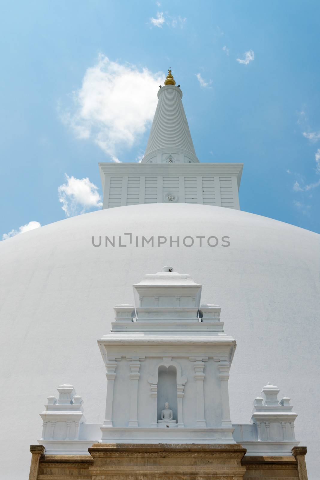 White sacred stupa Ruwanmalisaya under blue sky, Anuradhapura, Sri Lanka