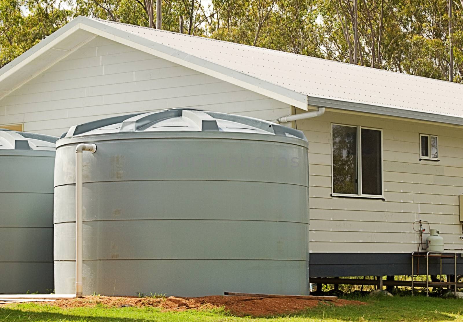 Rainwater conservation tanks on new house by sherj