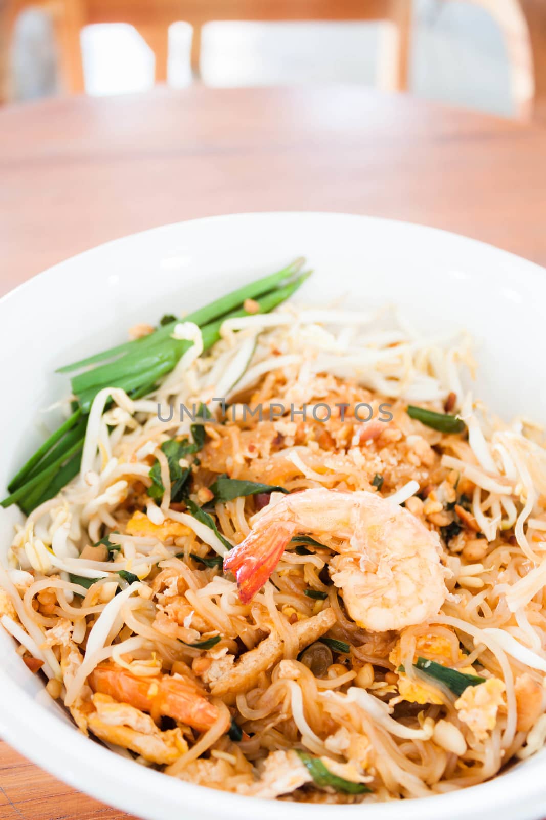 Stir fried noodle with shrimp in thai restuarant by punsayaporn