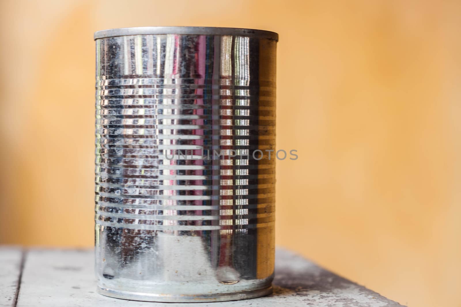 Closeup empty aluminum recycling can on wood table by punsayaporn