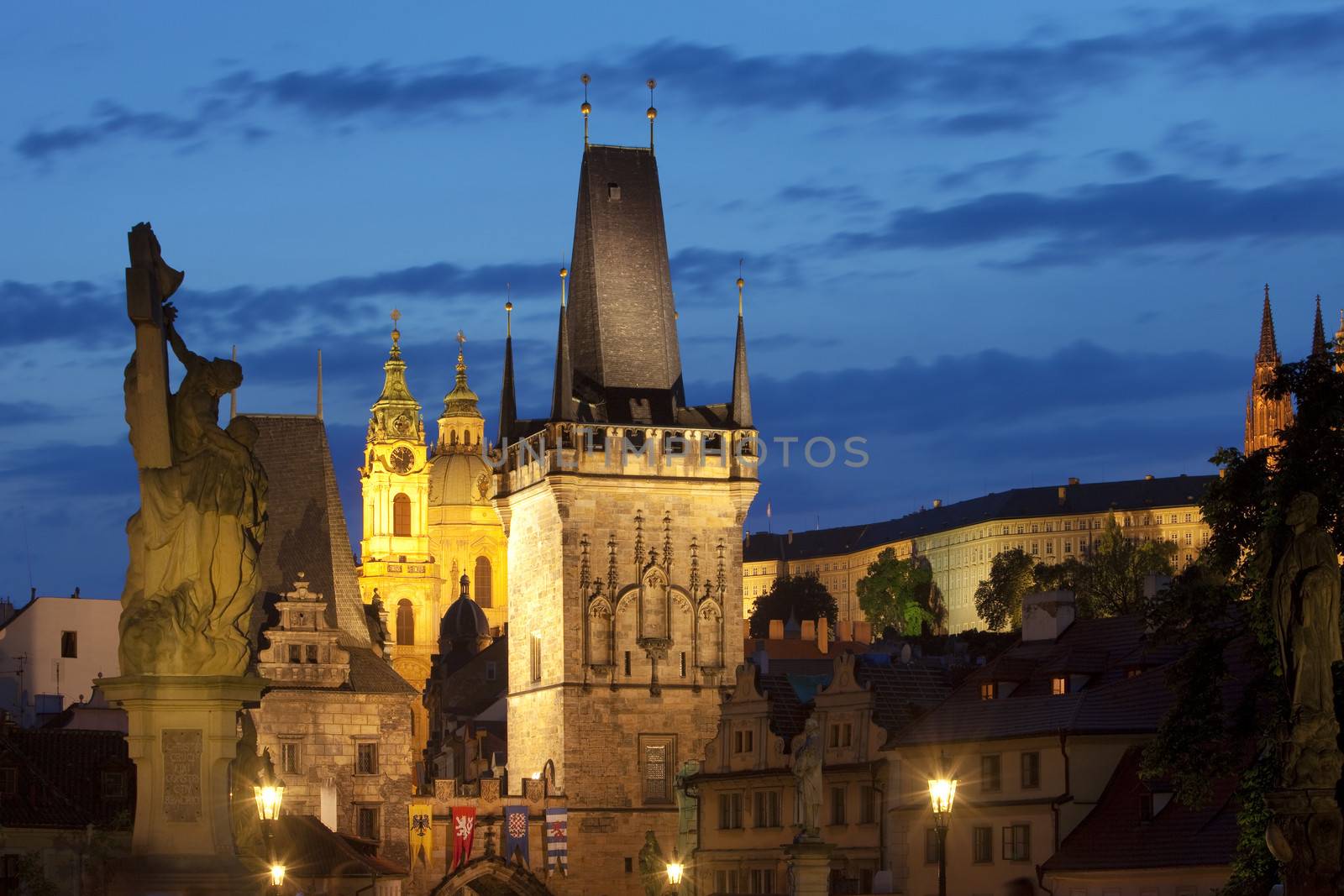 czech republic prague - charles bridge tower and st. nicolas church at dusk