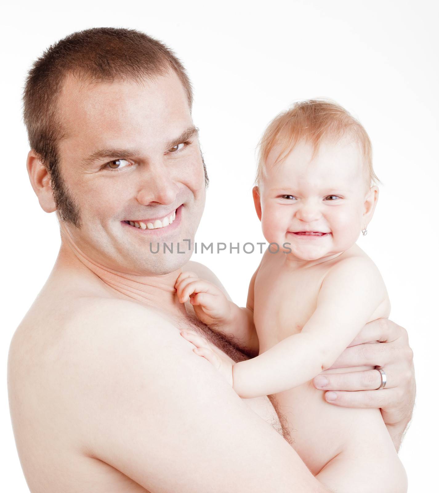happy father holding a baby girl smiling