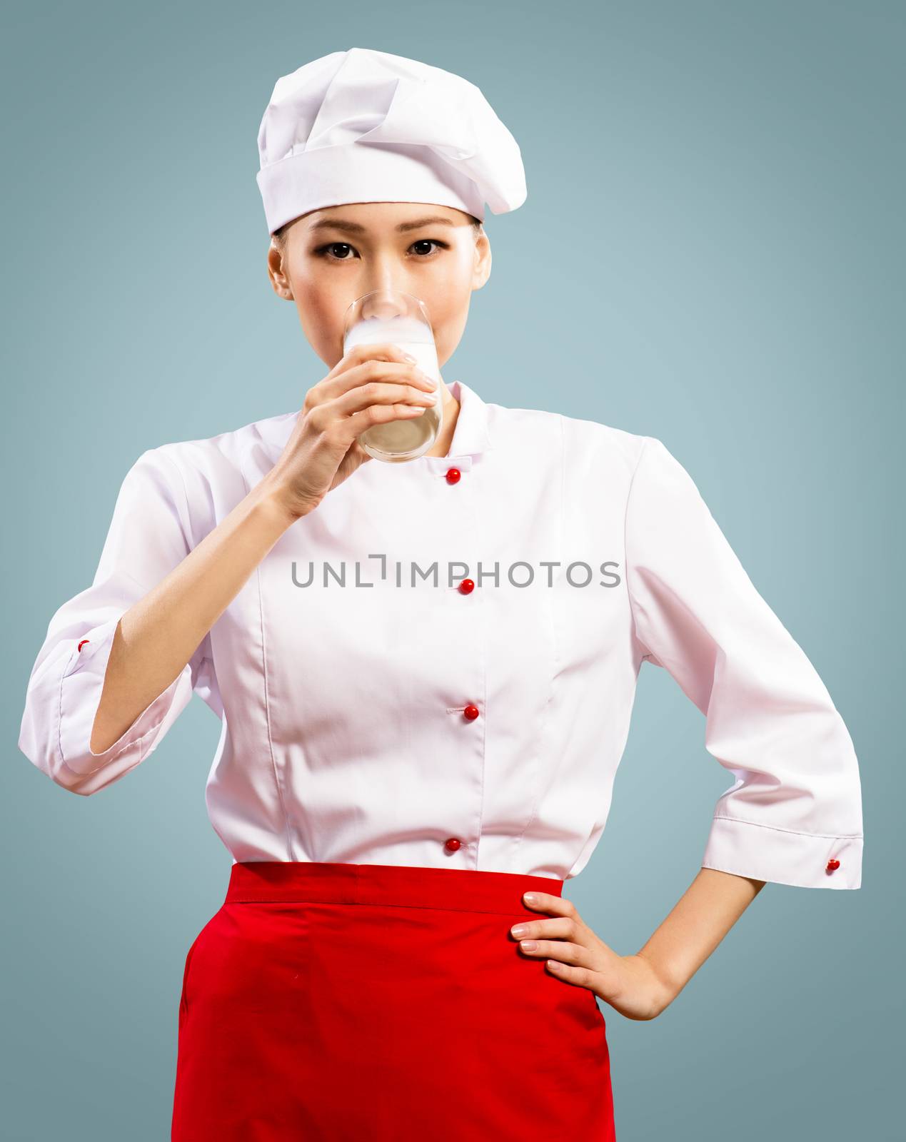 Portrait of Asian cooks, drink a glass of milk
