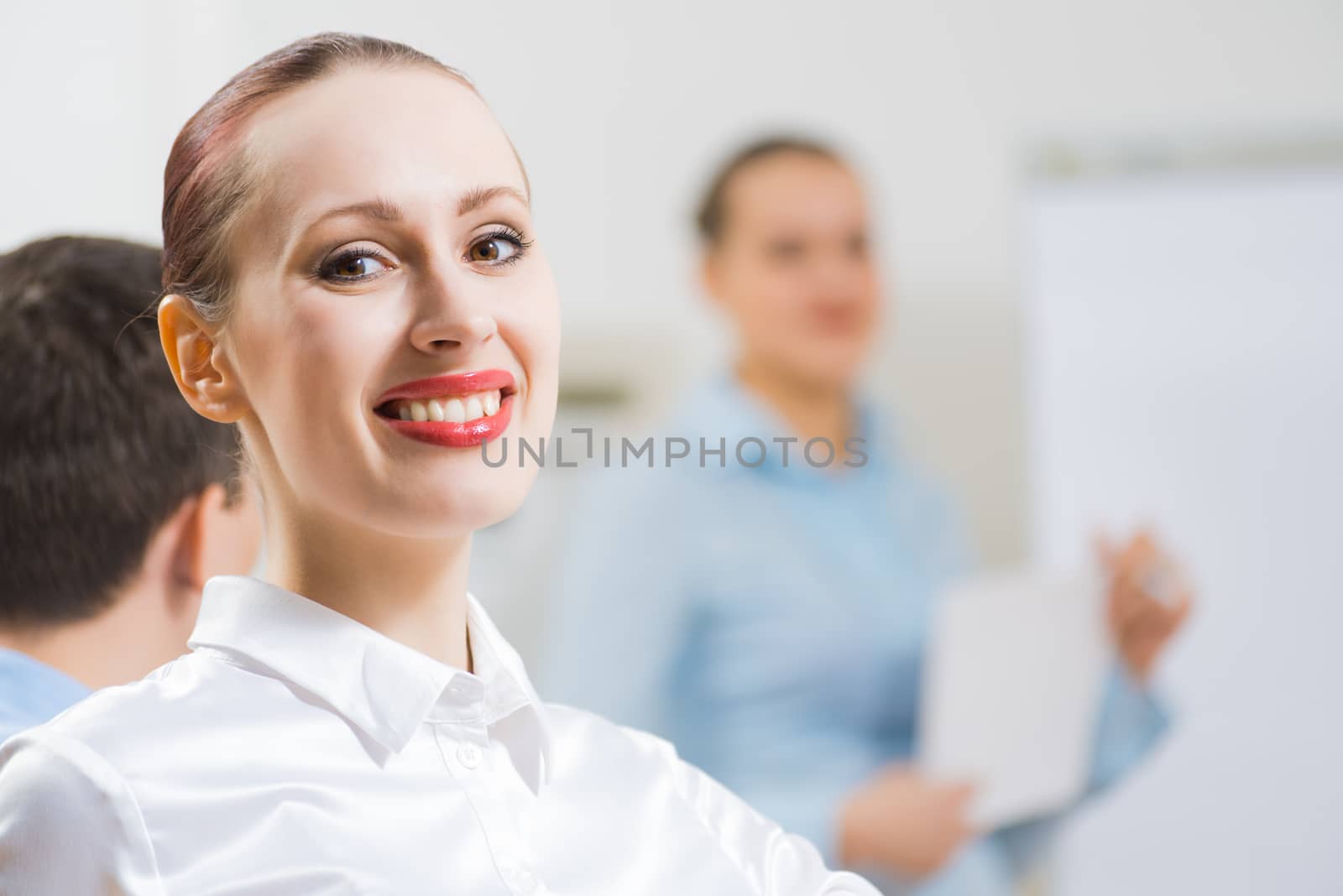 business woman doing a report next presentation boards, listening to her colleagues