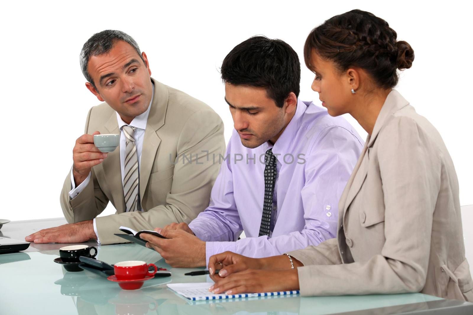 Three people sat on interview panel by phovoir